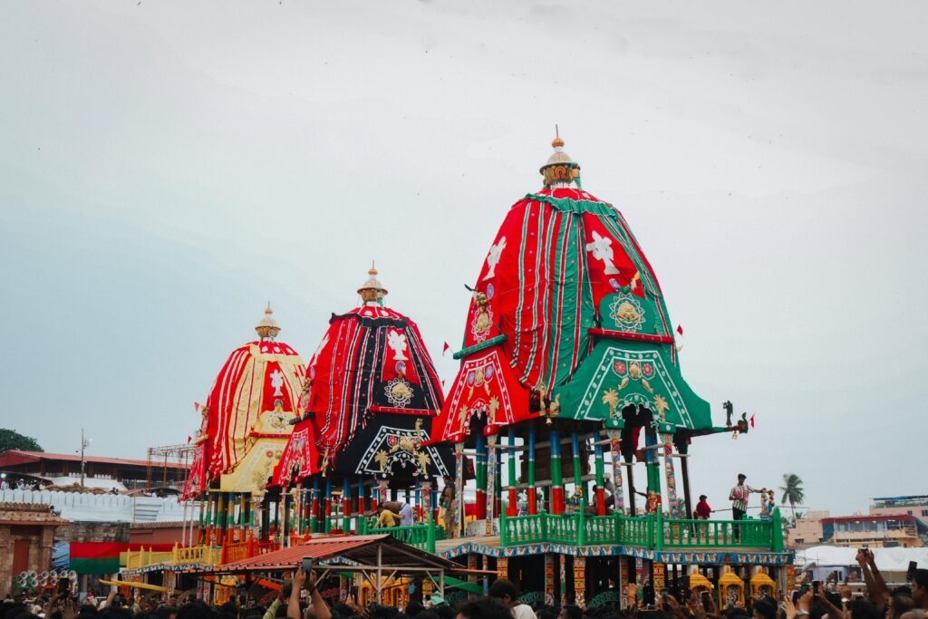 Three decorated Rath Yatra chariots outside the Jagannath Temple in Puri | Cultural Experiences in Odisha: Food, Heritage & Life