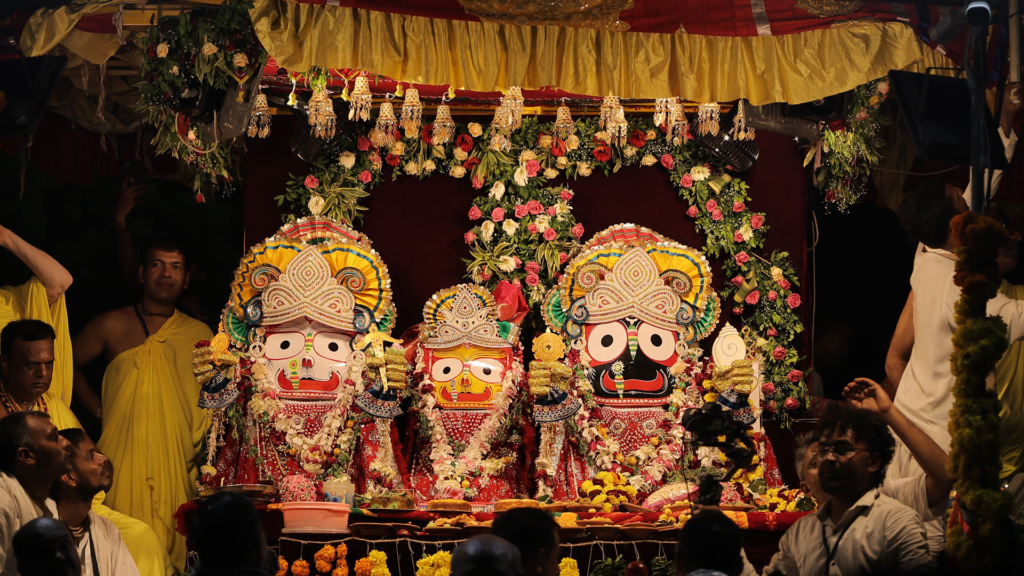 Decorated Jagannath Temple deities adorned with flowers and garlands