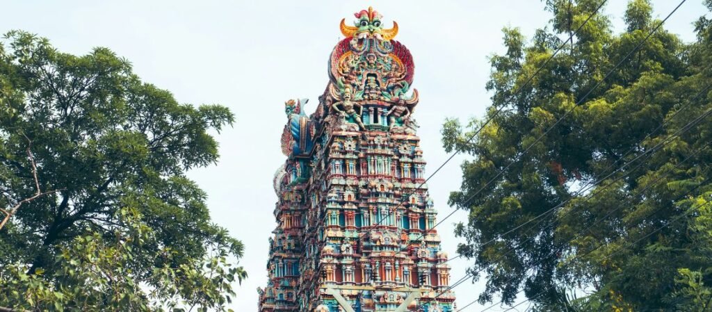 Meenakshi Amman Temple's painted gopuram in Madurai, part of Immersive Trips' customized tour packages in India