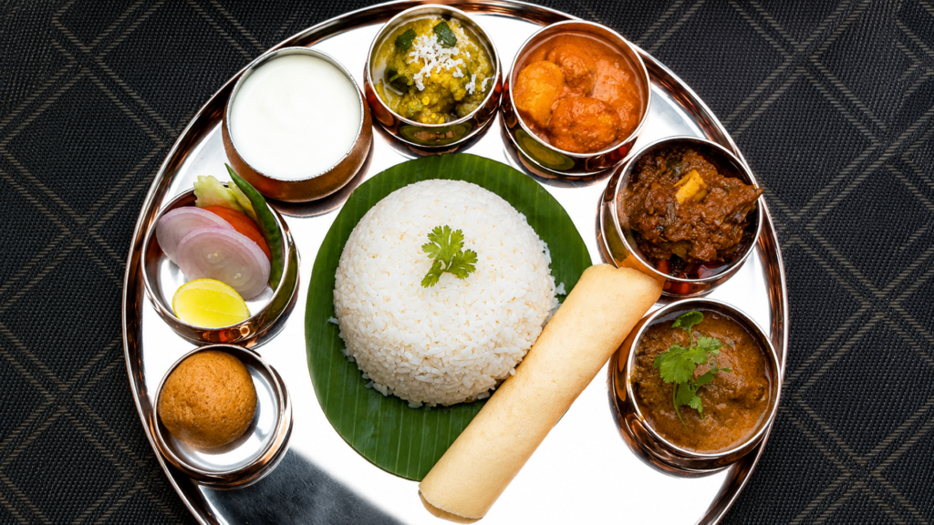 A full Odia thali with rice, dalma, curries and papad, the classic order at the best places to eat in Bhubaneswar	"Classic Odia Thali