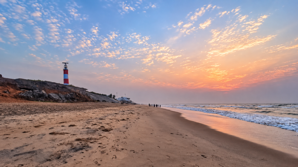 Sunrise over Gopalpur Beach with the lighthouse in the distance | Gopalpur Travel Guide