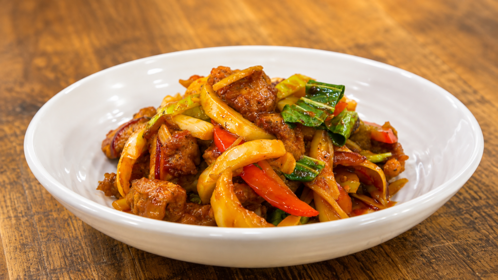 Best Places to Eat in Dharamshala: A Complete Food Guide 2 Spicy Tibetan-style stir-fried dish with vegetables in Dharamshala