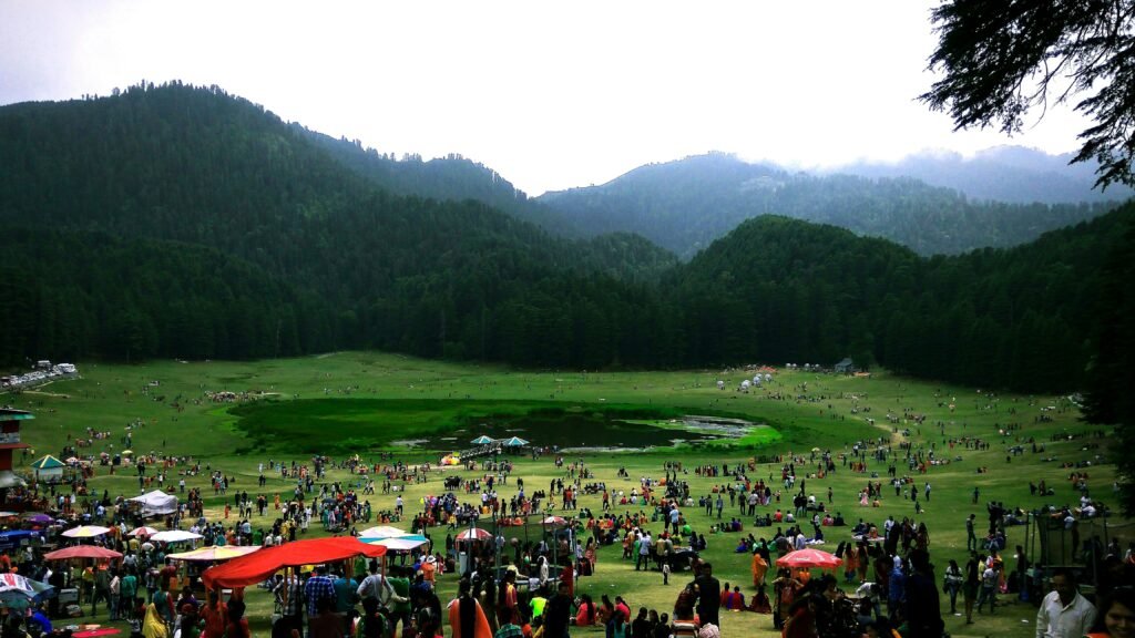 A Complete Dalhousie Travel Guide for First Time Visitors 2 Khajjiar Lake, which is situated inside a vast saucer-shaped meadow surrounded by dense cedar and deodar forests. Known across the world as the "Mini Switzerland of India