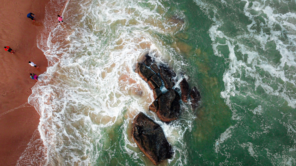 Aerial view of waves and rocks along Gopalpur Beach | Gopalpur Travel Guide