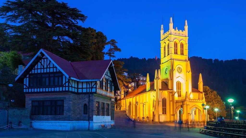 Shimla Manali Family Tour Package, a Himalayan Trip for Every Generation 4 Christ Church Shimla lit up at dusk on The Ridge beside a Tudor-style building